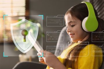 An image featuring a little girl using her tablet with a security logo representing safety image