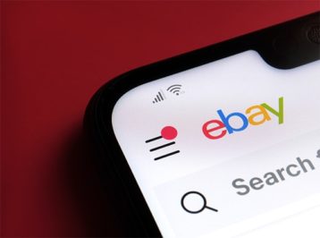 An image featuring eBay shopping on mobile phone concept