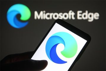 an image with microsoft edge logo on smartphone and in background 