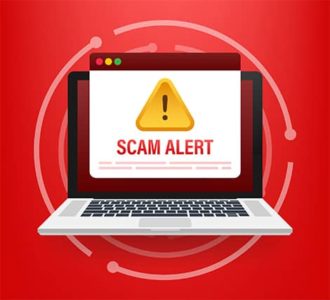 An image featuring laptop having a scam alert notification warning concept