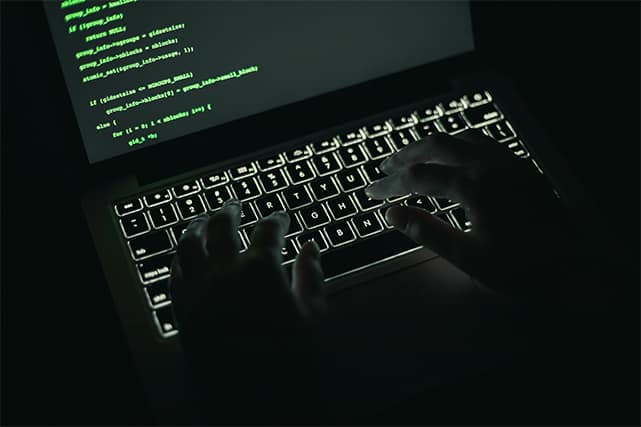 An image featuring a person hacking with code concept