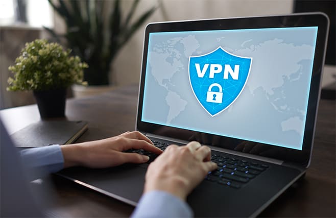An image featuring a person using a secure VPN on their laptop concept