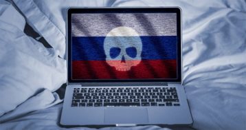 An image featuring a russian flag with a skull on it on a laptop concept