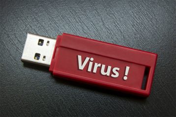 An image featuring an USB with a virus inside of it concept