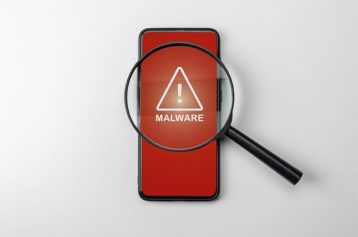 An image featuring malware warning sign on phone danger concept