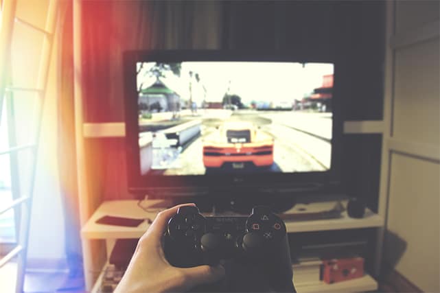 An image featuring a person gaming with his PlayStation controller representing gaming concept