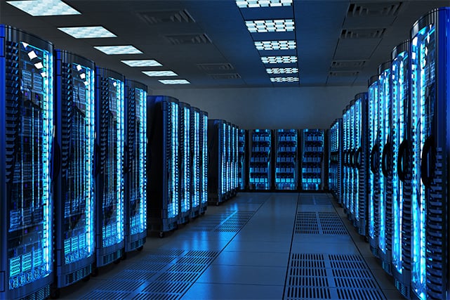 An image featuring multiple servers in a server room with blue lights concept