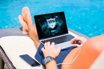 An image featuring a person laying next to a pool and is using a VPN on his laptop concept