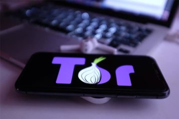 An image featuring the Tor Browser on the phone and on a laptop