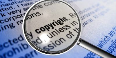 The word copyright under a magnifying glass