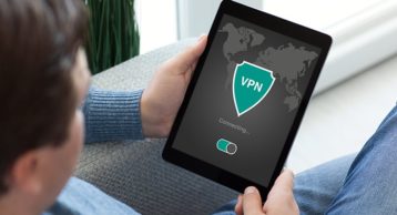 an image of a person connecting to a VPN from his tablet