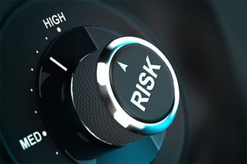 An image featuring a button that says risk and its positioned on high representing security risk 