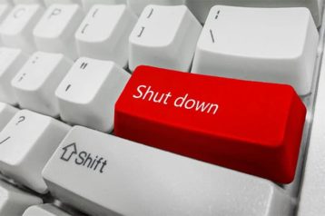 An image featuring a keyboard with the enter button changed with a red color that says shut down