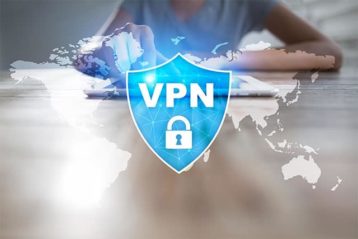 An image featuring a person using a tablet with the VPN logo in front of it