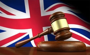 An image featuring the UK flag in the background representing UK law and justice concept