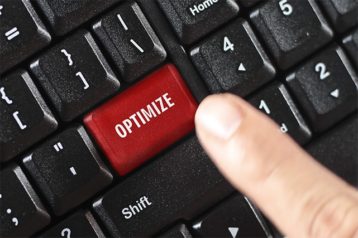 An image featuring a keyboard that has a custom red key that says optimize on it