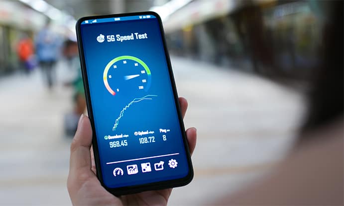 An image featuring a person testing their internet speed on their mobile phone outdoors concept