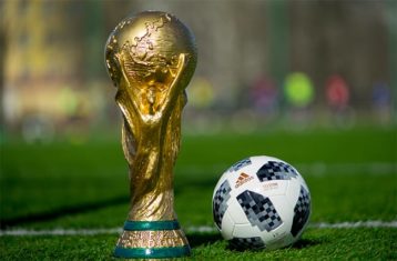 An image featuring FIFA trophy and football concept