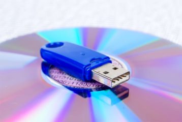 An image featuring a USB on top of a CD concept