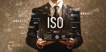 An image featuring a person holding some stats with ISO text representing ISO file concept