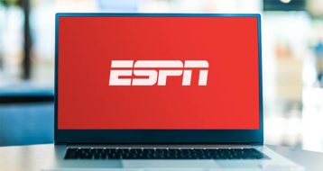 An image featuring a laptop with ESPN logo on screen