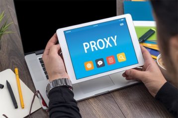 An image featuring a person holding a tablet and using a web proxy concept