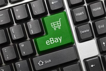 An image featuring a keyboard that has a custom key that says eBay on it concept