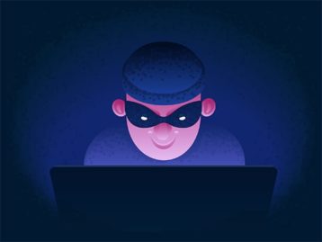 An image featuring a hacker using his laptop