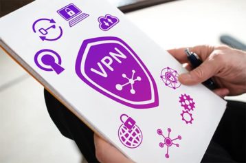 An image featuring a person holding a paper with VPN drawings on it representing VPN security concept