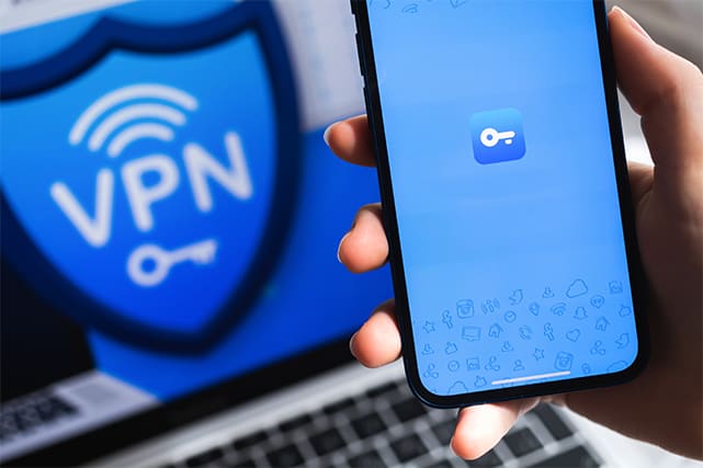 An image featuring secure VPN logo on laptop and mobile phone concept