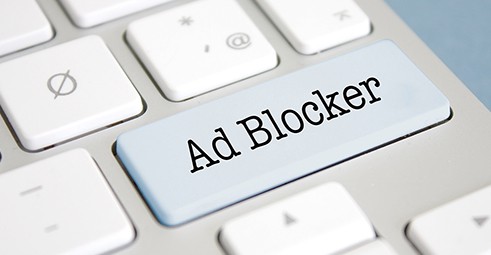 an image with ad blocker button on laptop keyboard 