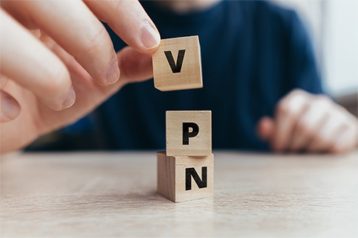an image with person writing VPN with  cubes 