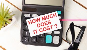 an image with calculator with how much does it cost note on it