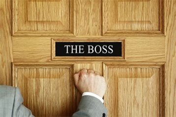 an image with a person knocking on the door of boss office