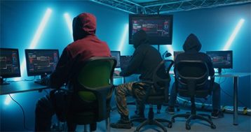 an image with group of hackers in a room