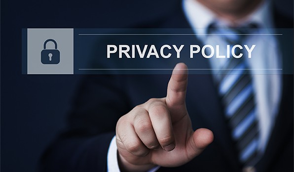 an image with businessman touching virtual privacy policy button