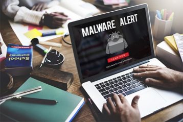 an image with malware alert on laptop
