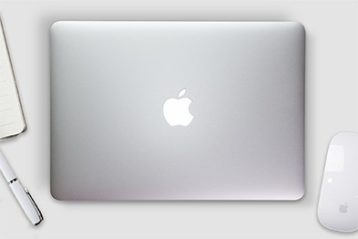 an image of a Mac laptop on desk