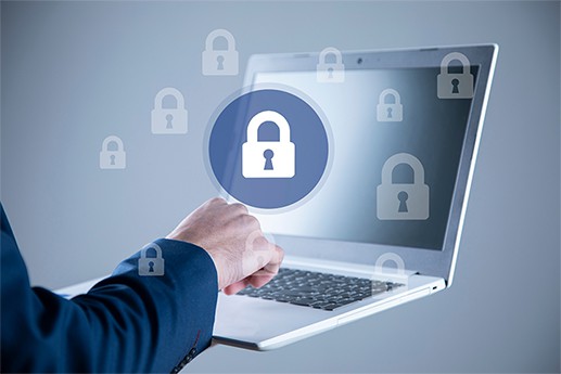 an image with person holding laptop with padlocks over him