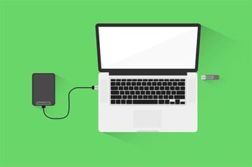 an image with external hard drive connected to laptop .vector illustration 