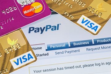 an image with PayPal account covered by credit cards 