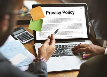 an image with Privacy Policy document opened on laptop 