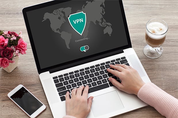 an image with person connecting VPN on laptop
