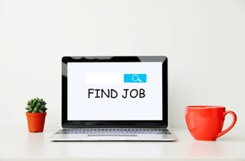 an image with find job text on laptop screen 