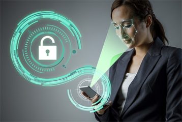 an image with woman unlocking her smartphone with facial recognition 