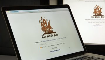 an image with pirate bay homepage opened on laptop