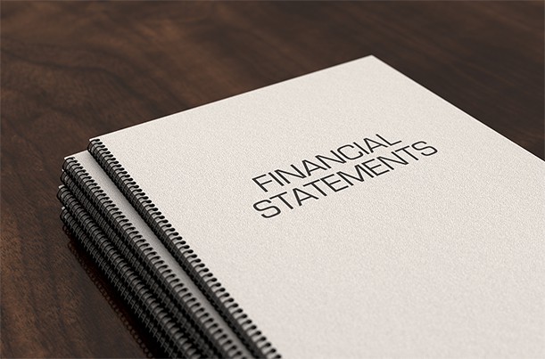 an image with Financial statements documents on desk 