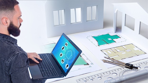 an image with software engineer next to architecture drawings 