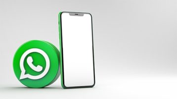an image with WhatsApp logo next to smartphone 