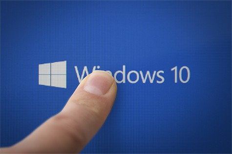 An image featuring a person pointing his finger to Windows 10 concept
